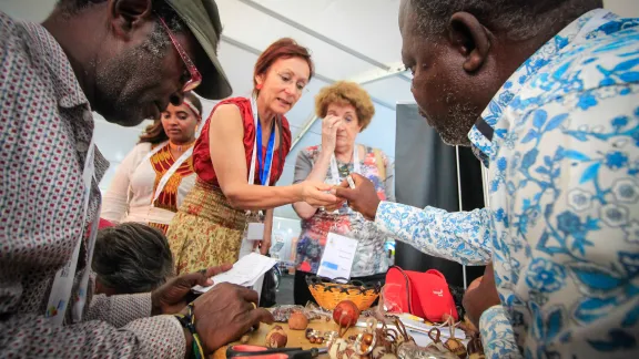 Windhoek, Namibia: A carver made custom items in the Omatala, an open space at the Lutheran World Federation's Twelfth Assembly, for exhibitions, workshops, and informal encounters. Photo: LWF/Johanan Celine Valeriano