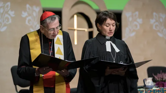 LWF General Secretary Rev. Dr Anne Burghardt (right) and Cardinal Kurt Koch of the Roman Catholic Church (left) pictured as worship with common word is celebrated with representatives from the Roman Catholic Church alongside a variety of different Christian traditions on the last day of the Lutheran World Federation Thirteenth Assembly. Photo: LWF/Albin Hillert Photo: LWF/Albin Hillert